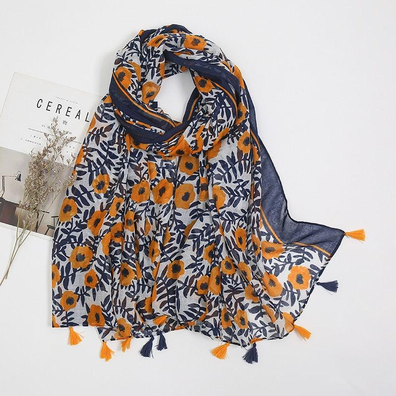 Foulard en coton bleu orné de fleurs orange