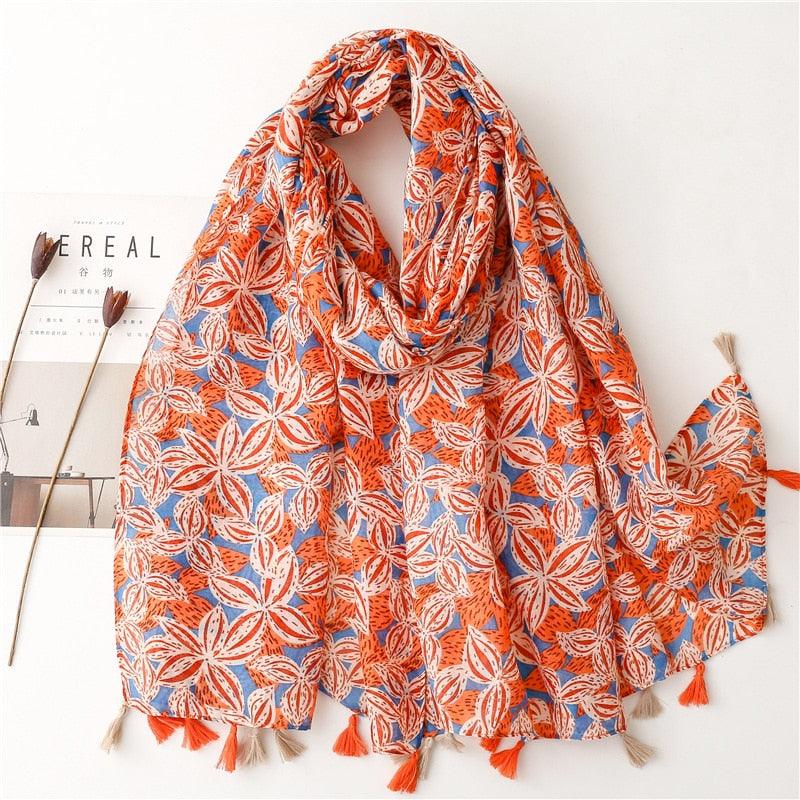 Foulard en coton orange et bleu avec motif feuillage